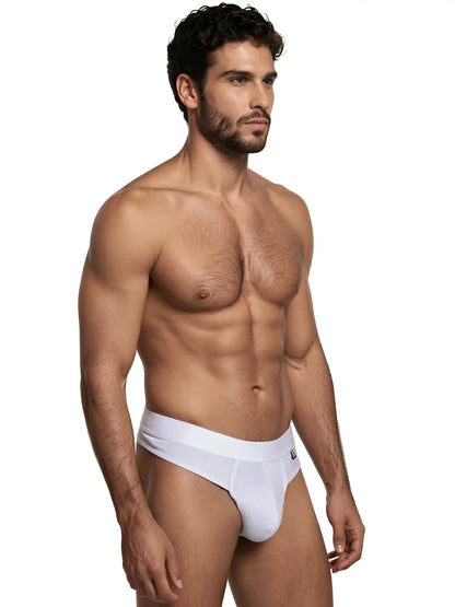 Xtremen white thong featuring a wide, solid waistband and subtle geometric pattern on the fabric.