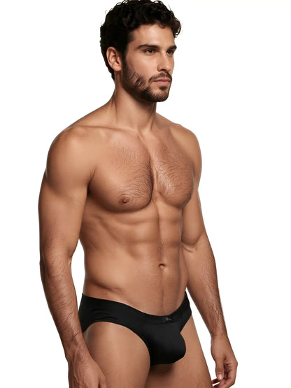 Xtremen black bikini brief in a sleek, form-fitting fabric on a fit male model.