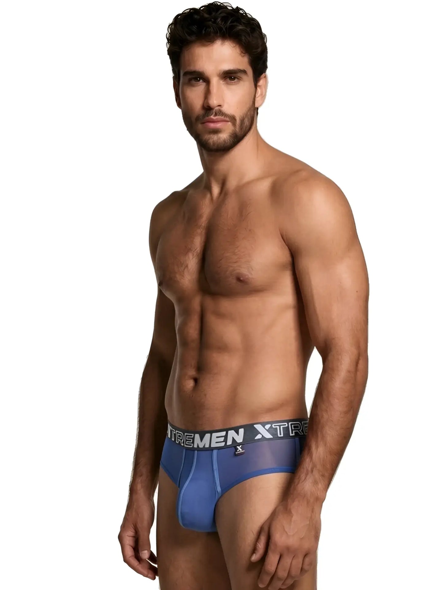 Model wearing sheer blue Xtremen bikini briefs with a branded grey waistband on a white background.