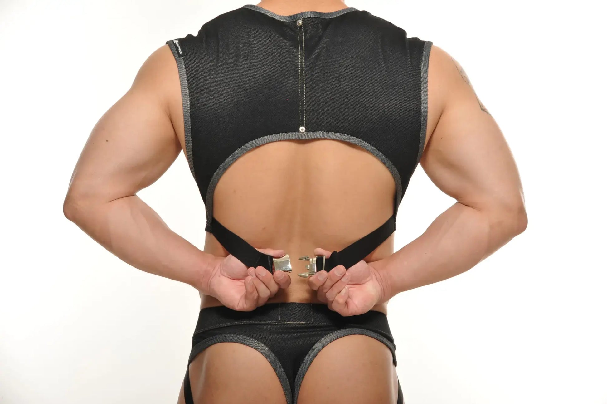 Black mesh backless Yannick muscle top with gray trim and adjustable straps for athletic use shown from back side