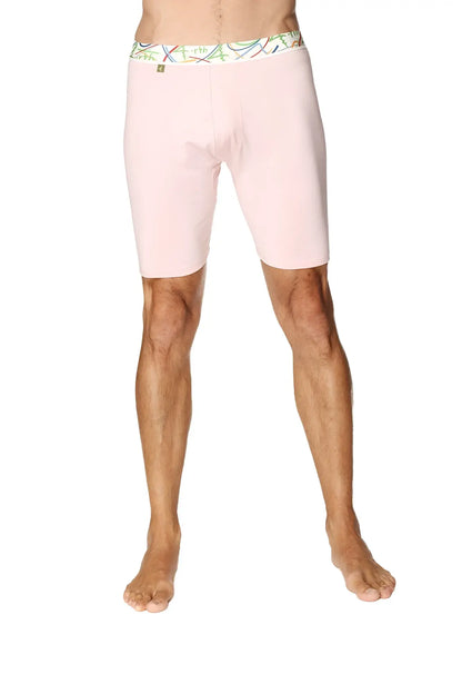 Pink yoga compression shorts for men with colorful patterned waistband designed for support and flexibility