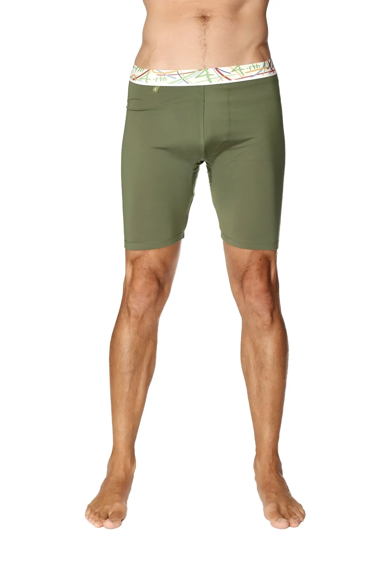 Olive green yoga compression shorts with white waistband and colorful abstract patterns for active wear