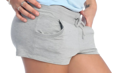 Gray heathered yoga training shorts with drawstring waistband and side pockets for comfortable workouts