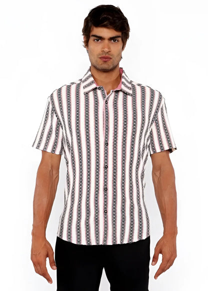 A man wearing a zigzag stripe open stretch knit shirt in white black and gray with a chain-like pattern