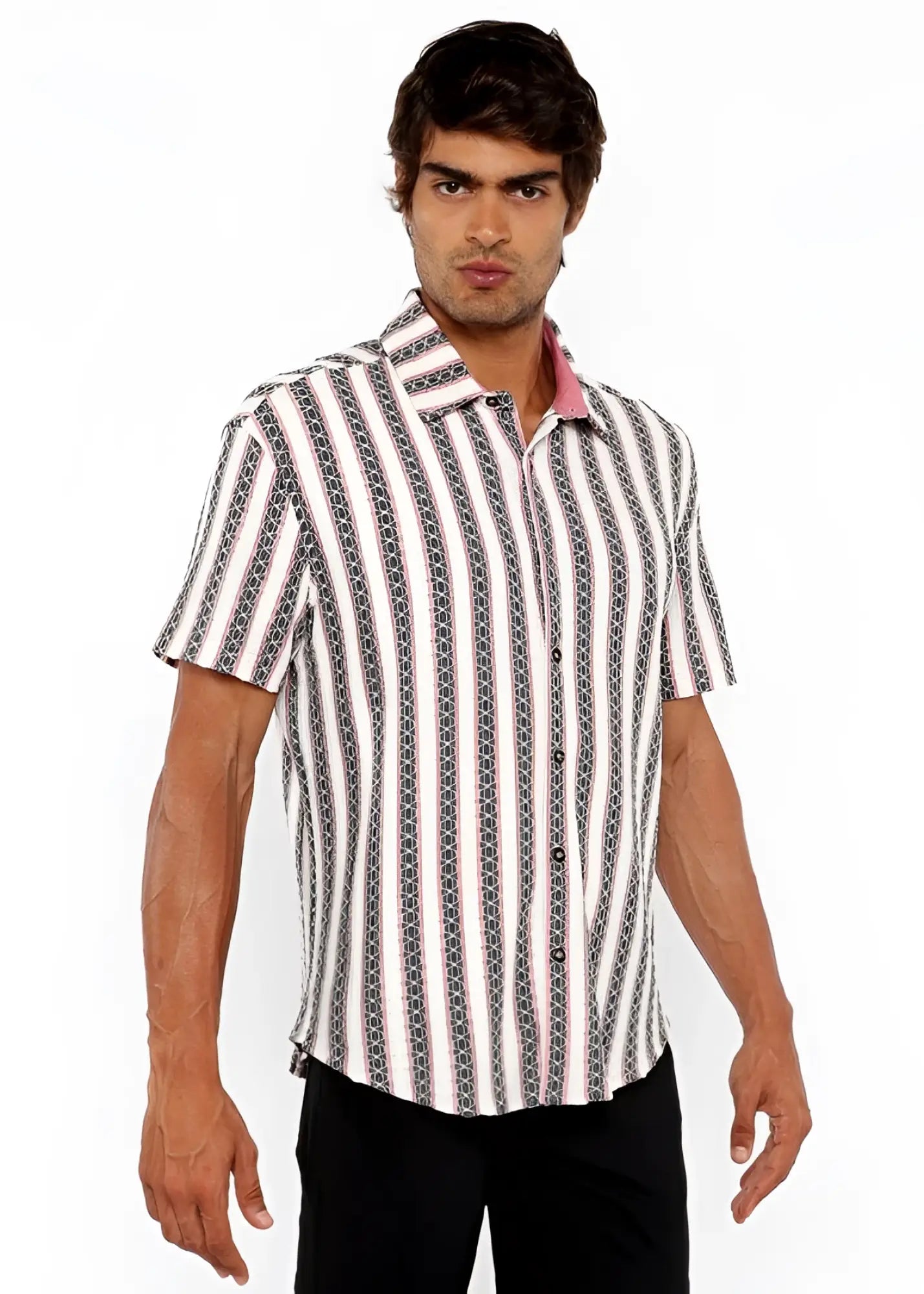 A man wearing a zigzag stripe open stretch knit shirt with vertical white gray and black geometric patterns