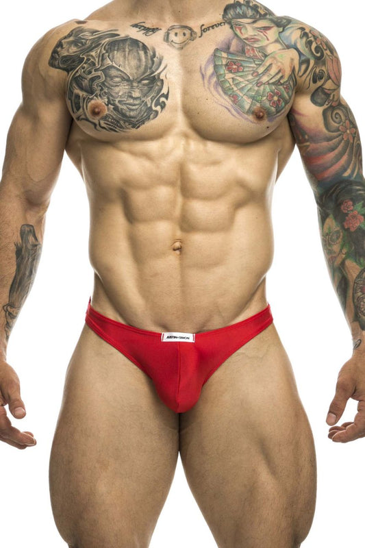Red men’s briefs with a white brand label at the waistband from justin simon xsj03 classic thongs color red collection
