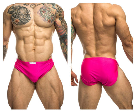 Vibrant pink JUSTIN+SIMON XSJ09 running shorts with a small white brand tag at the waistband for athletic use