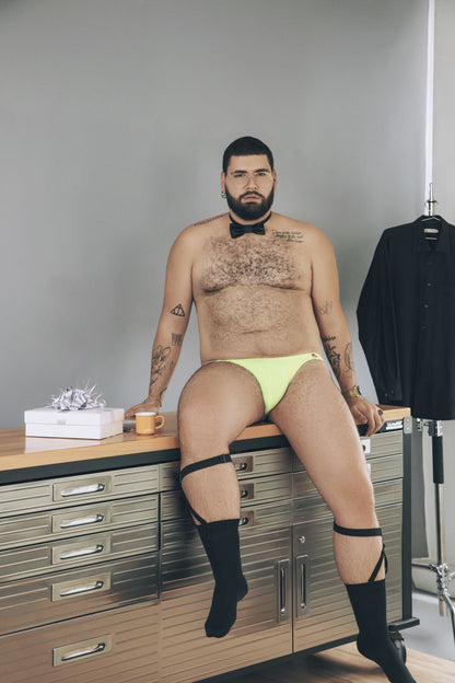 Bright lime green Pikante Angola thongs with black straps and bow tie detail for stylish lingerie wear
