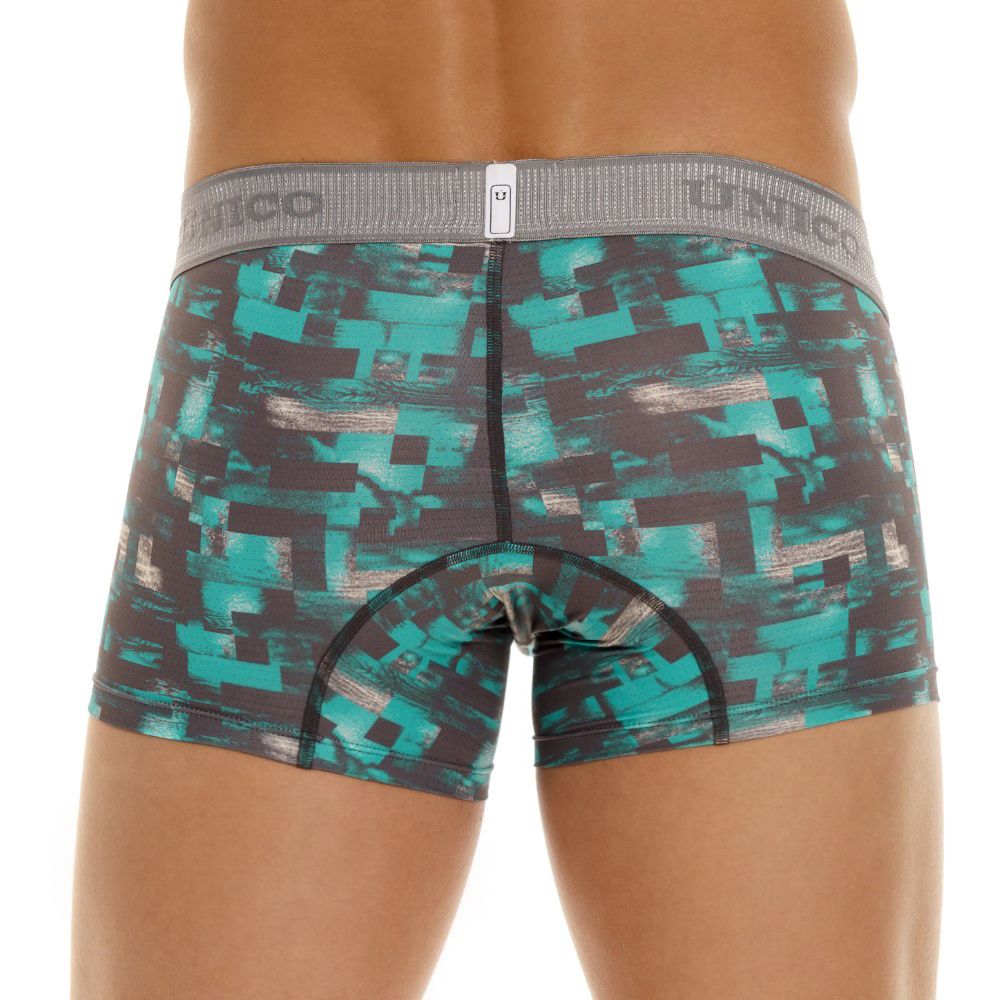 Teal and black pixelated patterned men’s boxer briefs with gray elastic waistband featuring Unico branding