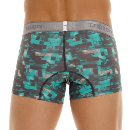Teal and black pixelated patterned men’s boxer briefs with gray elastic waistband featuring Unico branding