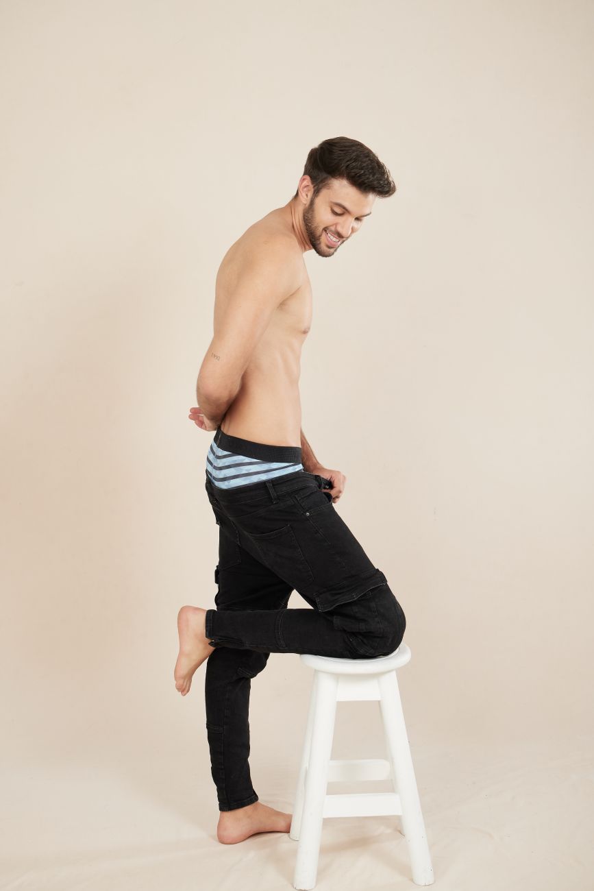 Black denim Unico Espectaculo trunks with turquoise striped waistband showing front side details