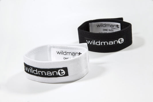 White and black elastic wristbands with wildman plus branding for the wildmant max cock ring product